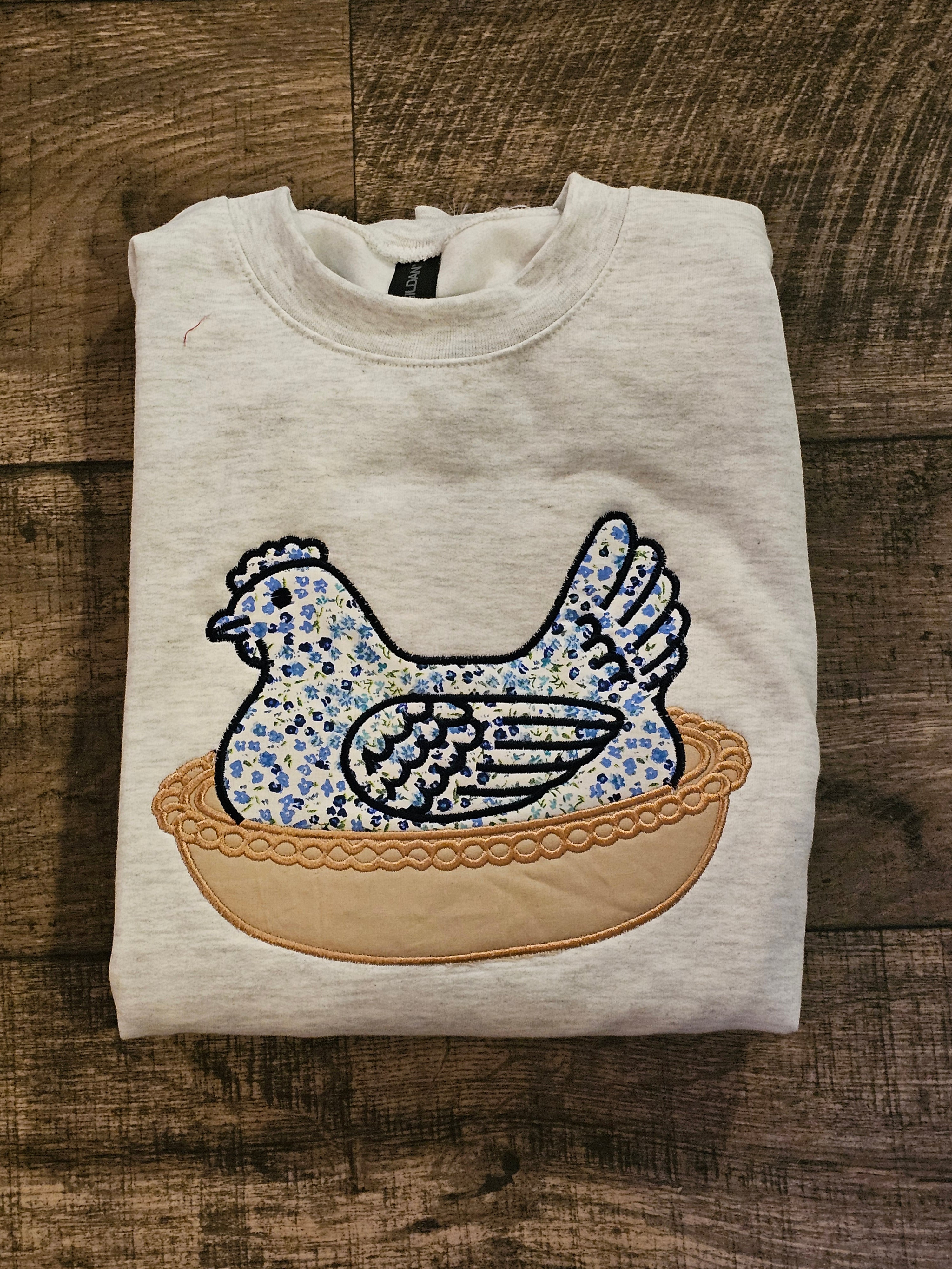 BLUE Hen in a basket